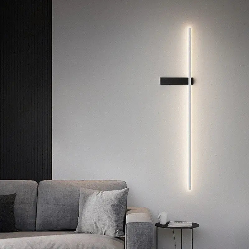 Modern black minimalist led wall light with sleek rectangular base and vertical soft white illumination by decorbites led wall