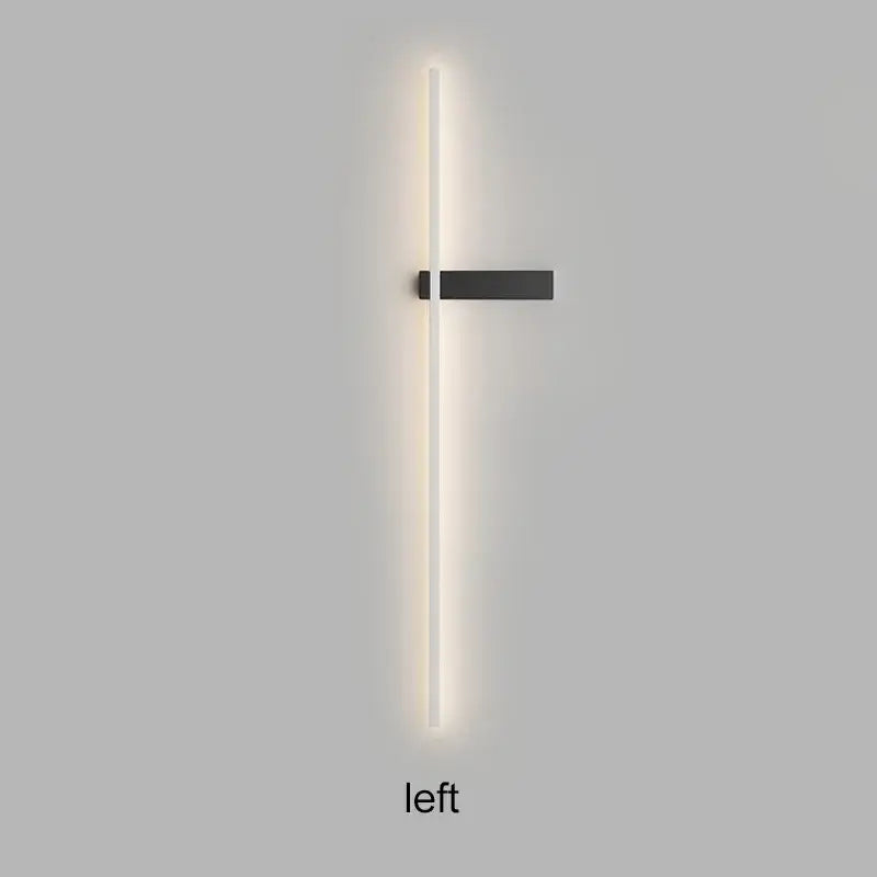Minimalist black led wall sconce with sleek vertical light bar emitting warm white illumination decorbites led wall lights