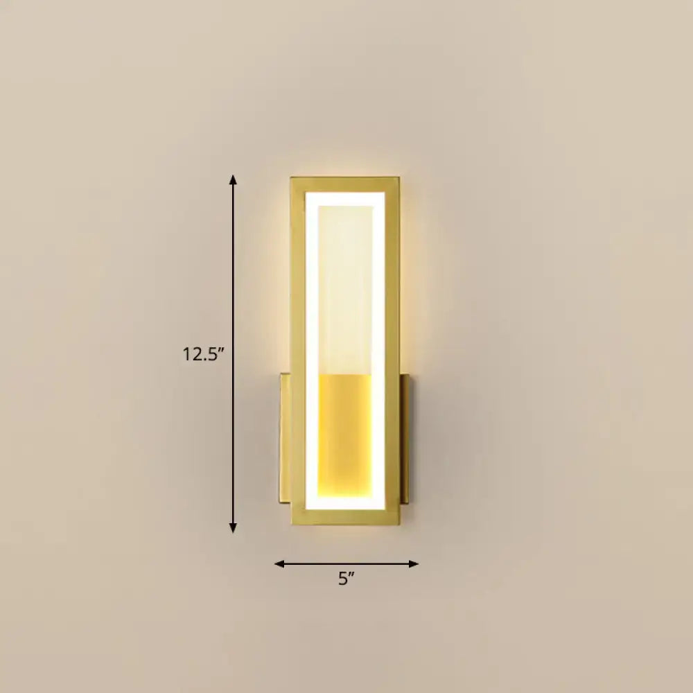 Modern black minimalist wall sconce with gold finish and glowing vertically divided rectangular led light panel for foyer