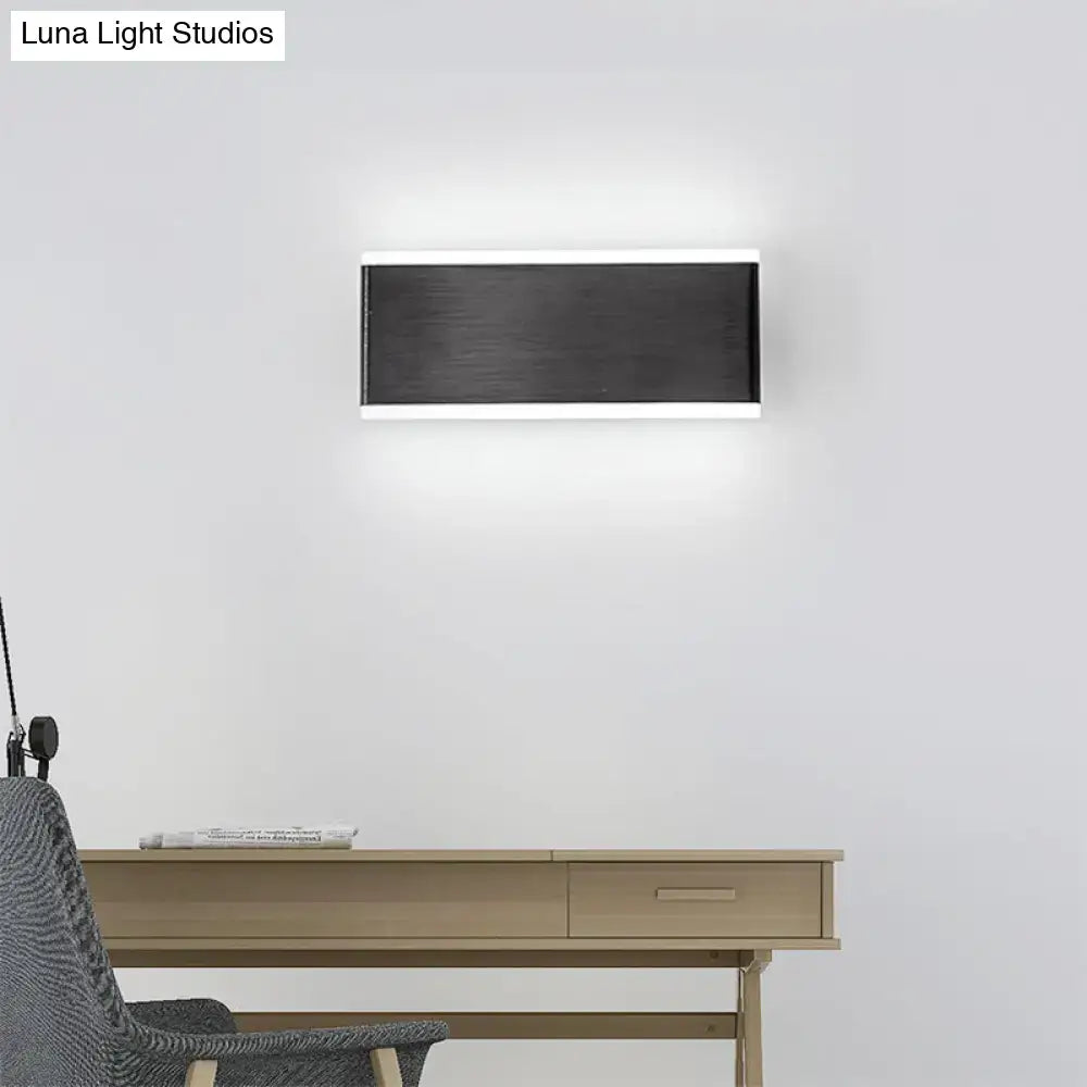 Modern black minimalist rectangular wall light fixture with brushed metal finish and integrated LED lighting for dining room