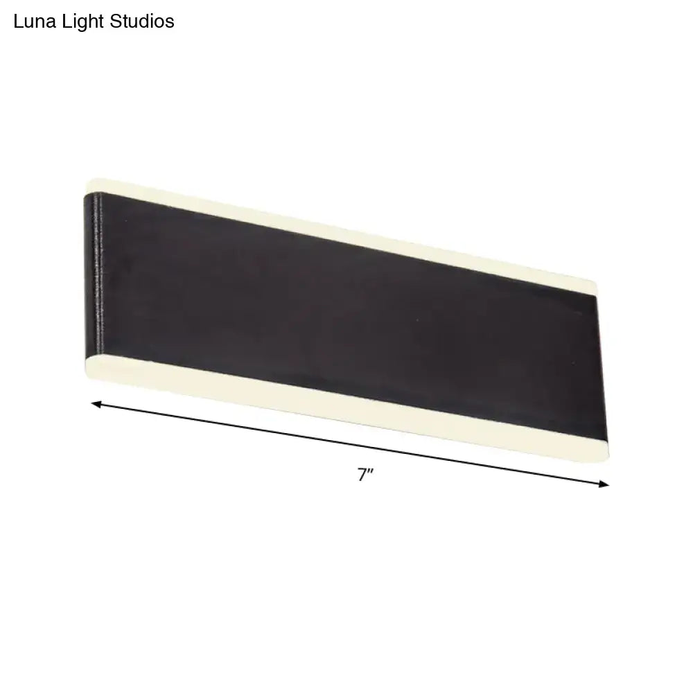 Modern black minimalist rectangle wall light fixture with black and cream magnetic strip designed for dining room use