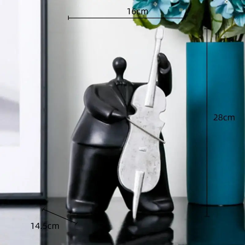 Black glossy figurine of musician holding silver cello modern black musical instrument band decor for living room