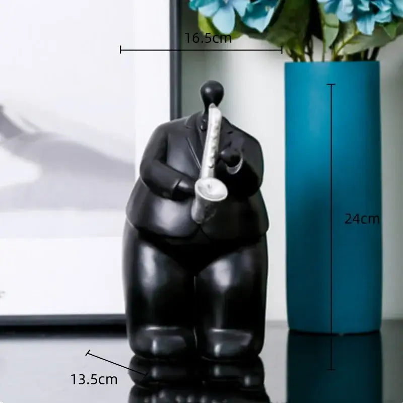 Modern black glossy figurine of a man in a suit playing saxophone musical instrument band decor for living room
