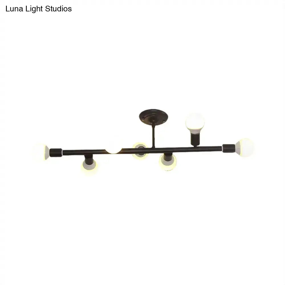 Black metal ceiling fixture with five spherical frosted glass bulbs in a modern open bulb island light design