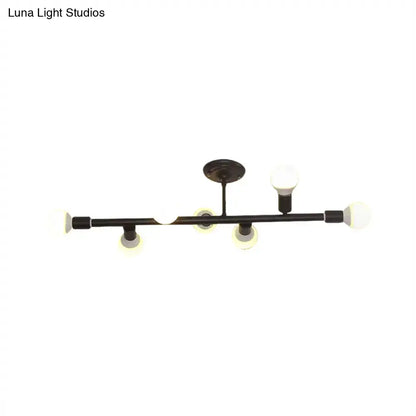 Black metal ceiling fixture with five spherical frosted glass bulbs in a modern open bulb island light design