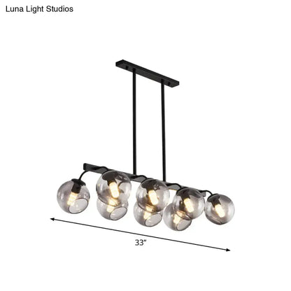 Black metal chandelier with five spherical smoked glass orb shade globes for kitchen and dining room lighting