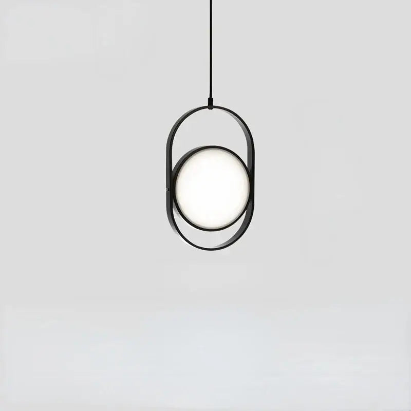 Minimalist black metal decorbites adjustable angle pendant light with glowing circular bulb for shop or kitchen decor