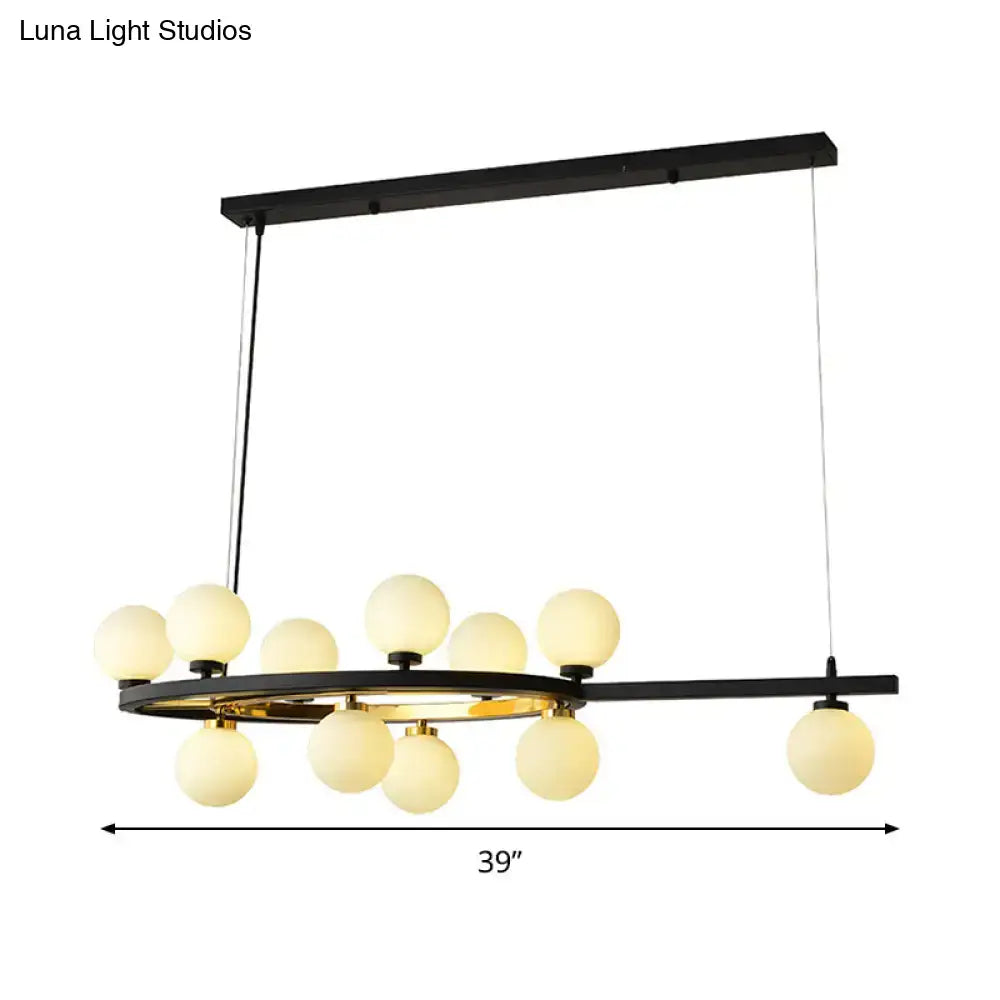 Modern black oval hanging light fixture chandelier with a circular metal frame and frosted glass globe lights for dining room