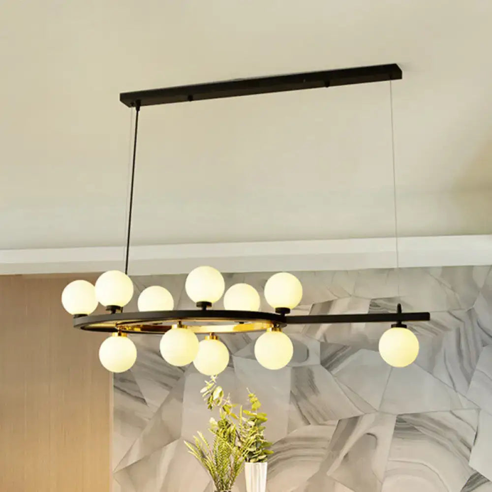 Modern black oval hanging light fixture with ten frosted glass globe bulbs in a circular pattern for dining room