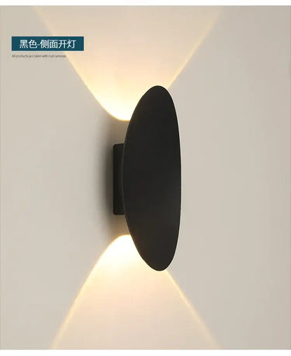 Modern black oval led outdoor porch wall light with black matte finish casting warm v-shaped light decorbites led outdoor
