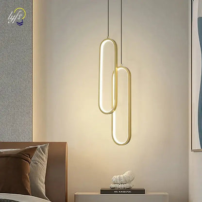 Modern black oval pendant light with led bulbs and gold-toned sleek design providing warm ambient glow