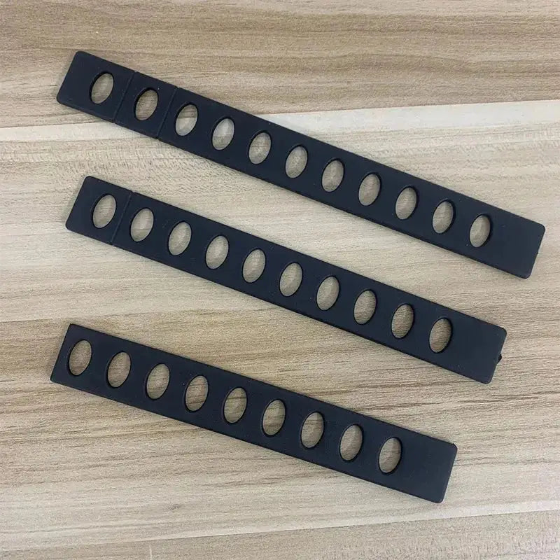Modern black patterned plastic knife blade protector strips with oval cutouts for decorbites knife blade safety