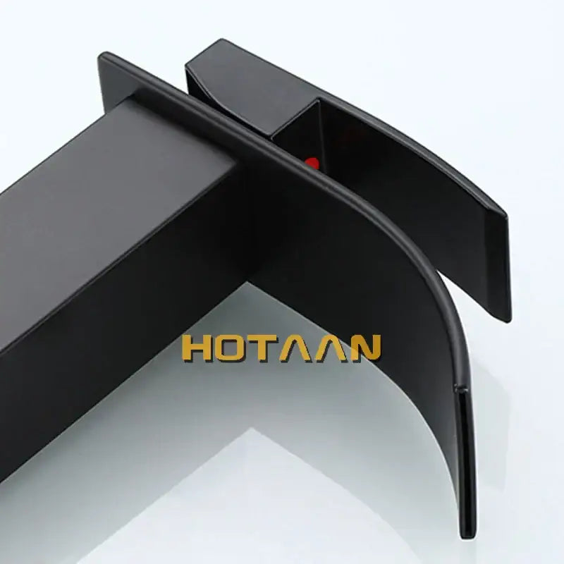 Modern black plated brass bathroom mixer with sleek black matte-finished car door handle trim and subtle red accent