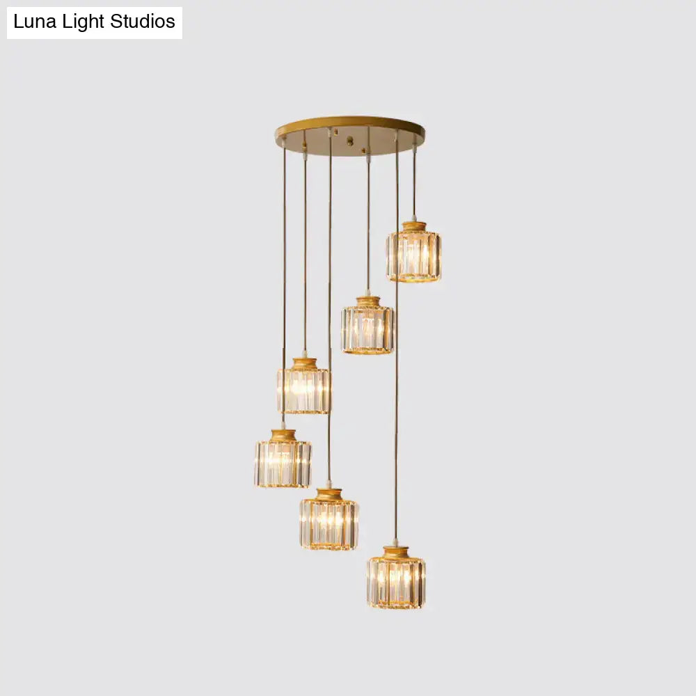 Gold-toned DecorBites™ modern prismatic crystal cylindrical pendant chandelier with five cascading crystal glass shades for stairway