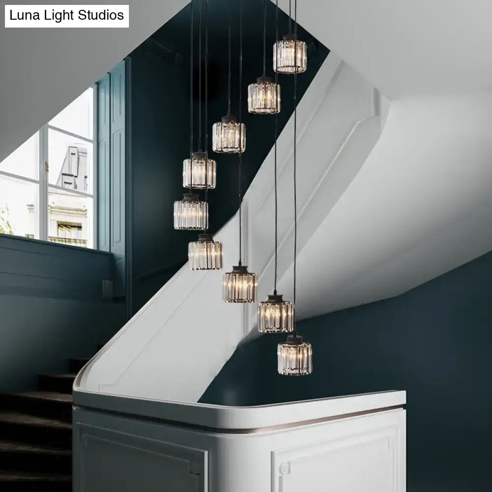 DecorBites™ modern prismatic crystal cylindrical pendant light with black gold finish and faceted glass shades for stairway