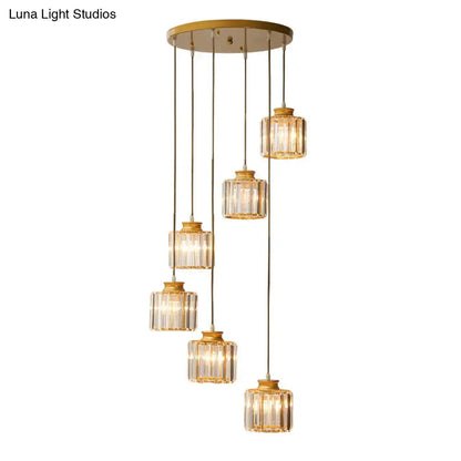 Gold-toned prismatic crystal cylindrical pendant chandelier with five faceted glass shades for stairway lighting