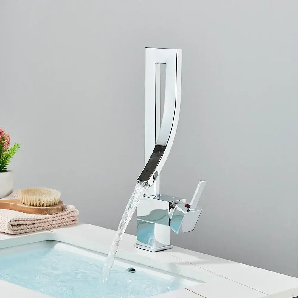 Modern chrome basin faucet with sleek waterfall spout and single handle mixer tap for bathroom use