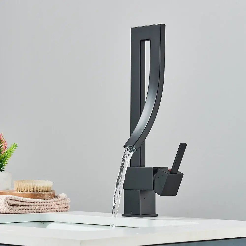 Modern black quartz basin faucet with matte finish single handle mixer tap featuring sleek geometric design