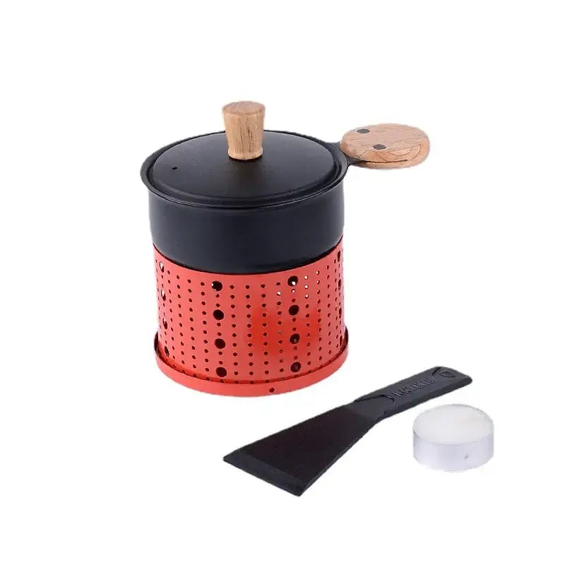 Modern black raclette fondue set with a red perforated metal pot black lid wooden handle spatula and tealight for dining table grill