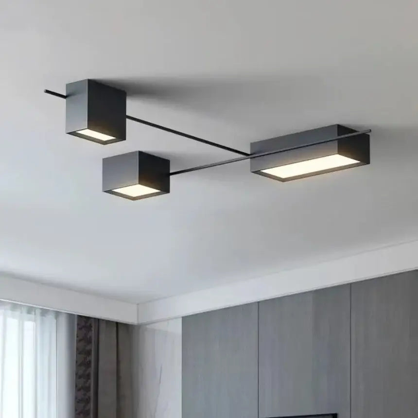 Modern black rectangular led ceiling light with two square and one elongated illuminated panels for living room decor