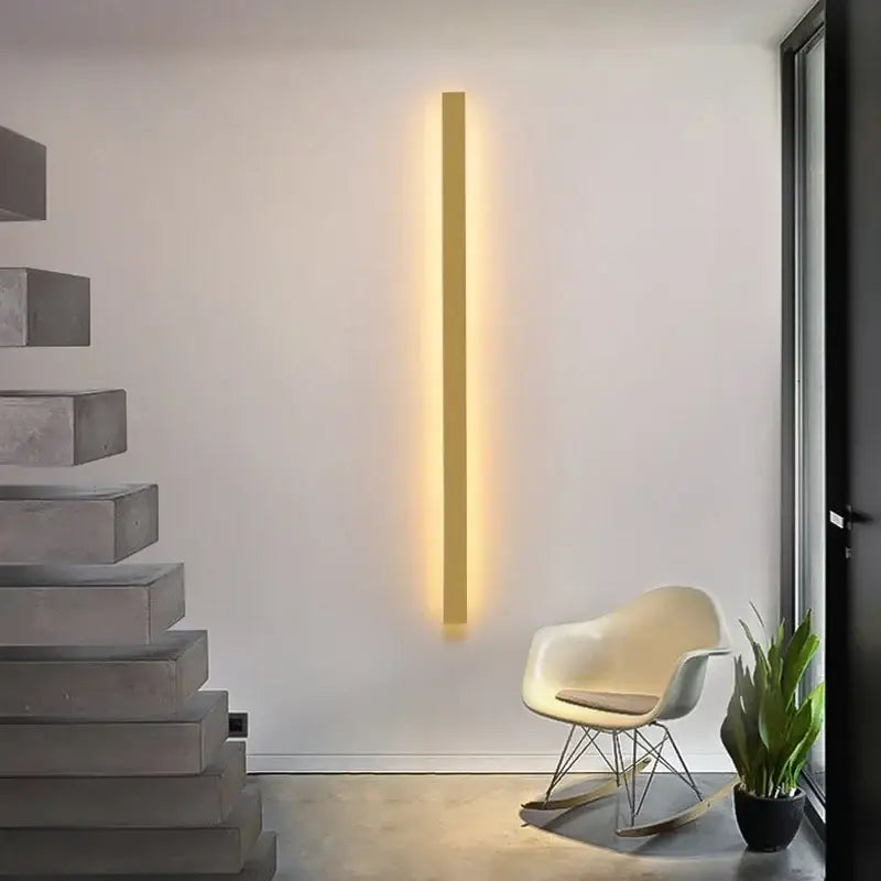 A sleek modern black rectangular led wall lamp with warm yellow glow and minimalist design for living room use