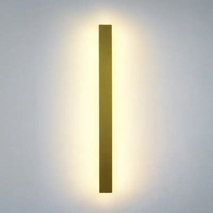 Modern black rectangular LED wall light with gold finish emitting warm soft glow for decorbites LED wall light decor