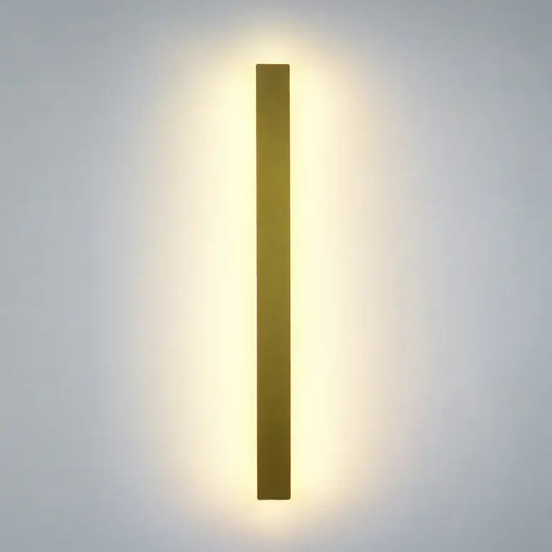 Modern black rectangular LED wall light with gold finish emitting warm soft glow for decorbites LED wall light decor
