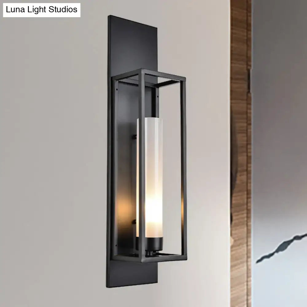 Modern black rectangular wall lamp with glass shade featuring a clear cylindrical cover and illuminated light source