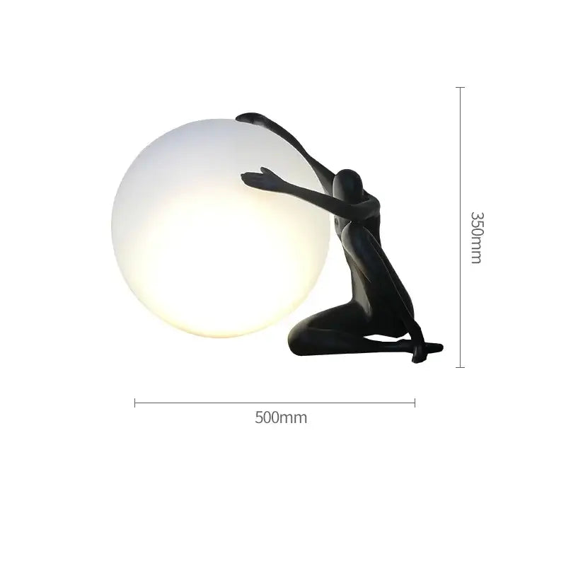 Modern black and red decorbites abstract humanoid table lamp with black sculpted ball holder and glowing white globe
