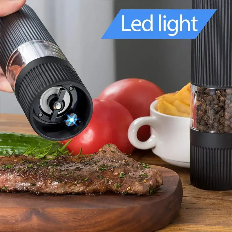 Modern black ribbed automatic salt pepper grinder with silver accent and led light for precise kitchen milling