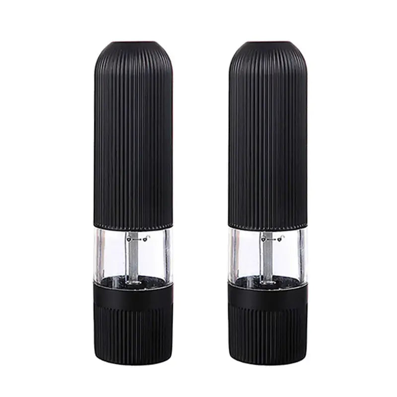 Modern black ribbed automatic salt pepper grinder set with clear glass sections and textured bodies for kitchen use