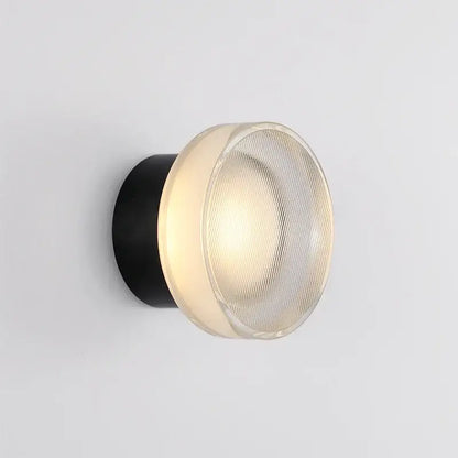 Modern black wall sconce with ribbed frosted glass dome and cylindrical base for decorbites elegant glass led bedroom lighting