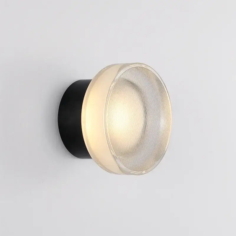 Modern black wall sconce with ribbed frosted glass dome and cylindrical base for decorbites elegant glass led bedroom lighting