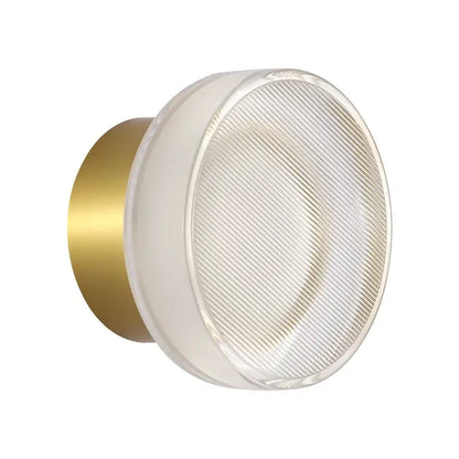 Modern wall sconce with brushed gold backplate and frosted ribbed glass diffuser for decorbites elegant glass led lighting