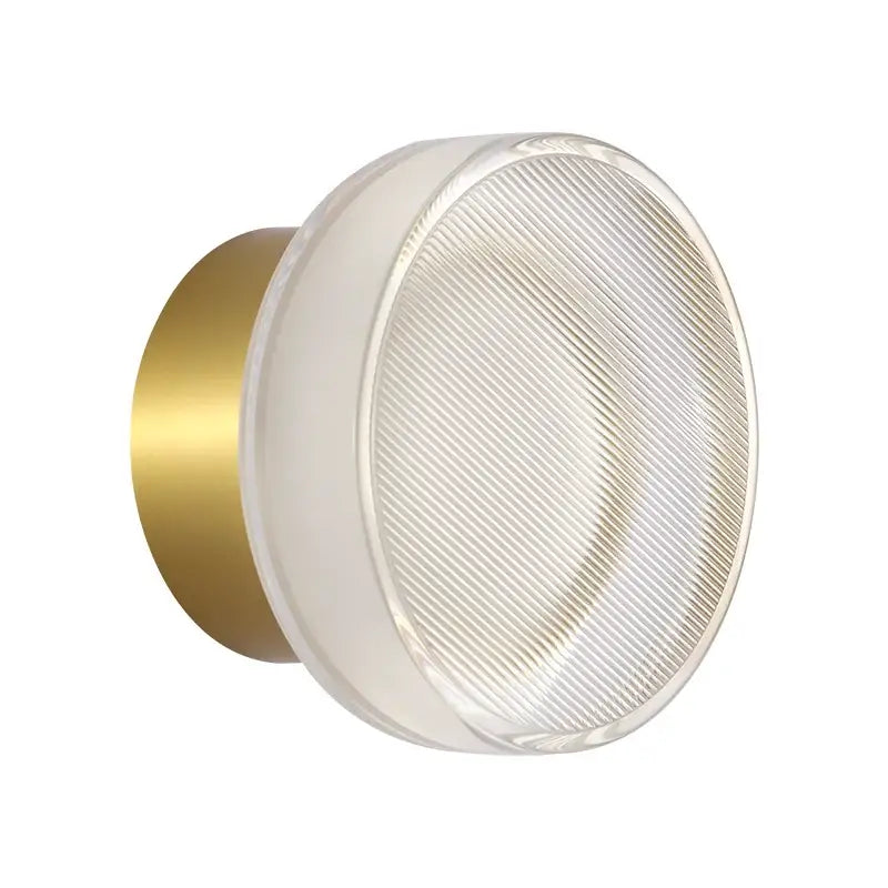 Modern wall sconce with brushed gold backplate and frosted ribbed glass diffuser for decorbites elegant glass led lighting
