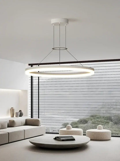 Modern white circular pendant chandelier with thin metallic rods complementing decorbites black ring design