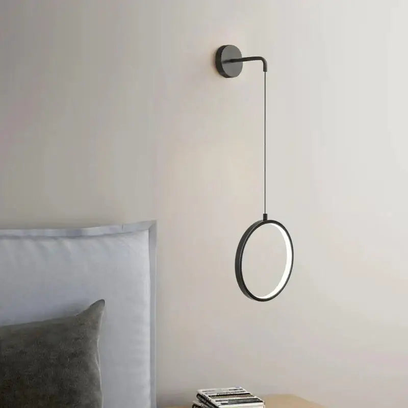Modern black ring led wall lamp with a sleek circular design and illuminated ring for bedroom decorbites black ring sconce light