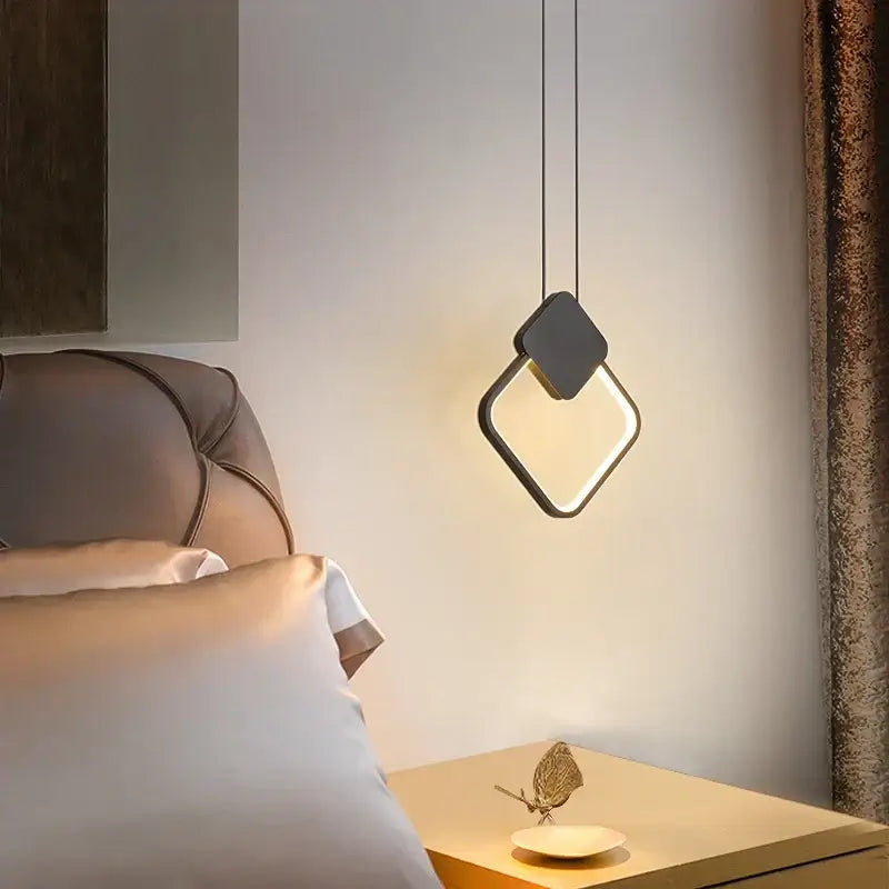 Modern black ring pendant lamp with diamond-shaped design and glowing center ideal for bedroom decorbites black ring lighting