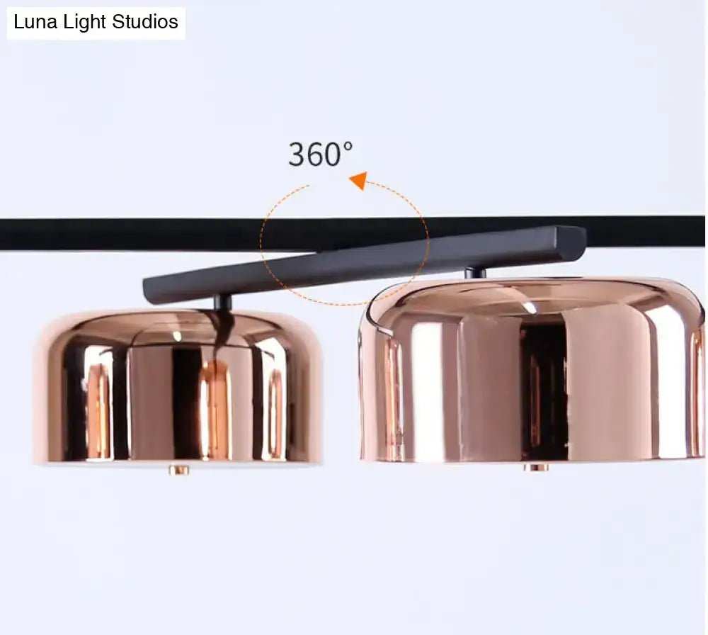 Modern black rose gold diner island lamp with copper-finished dome pendant lights and sleek black mounting bar
