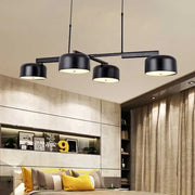 Decorbites™ linear modernist island pendant light with four black matte drum shades and rose gold accents for led or incandescent bulbs