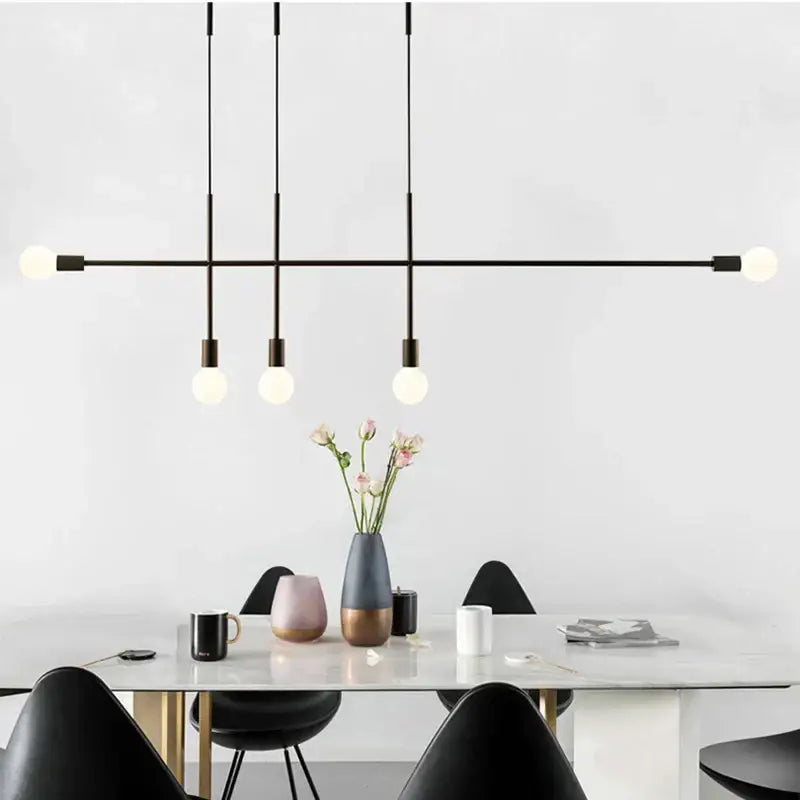 Modern black and rose gold minimalist pendant light with spherical bulbs and sleek metal rods for dining room decorbites black rose gold