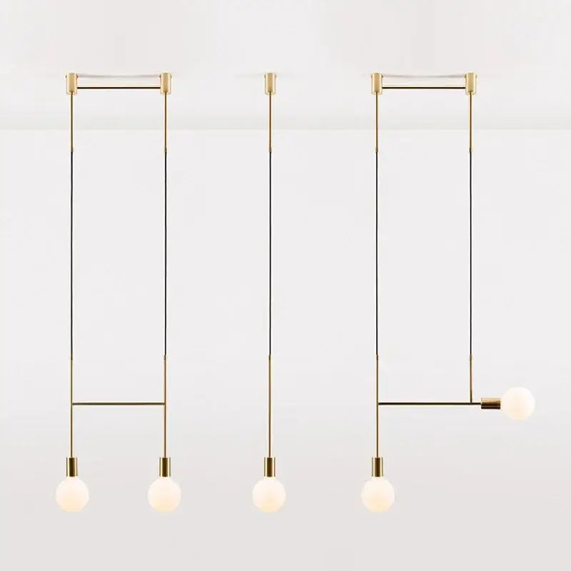 Modern black rose gold pendant light with minimalist brass frame and frosted glass globe bulbs for dining room decorbites black rose