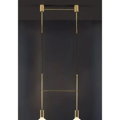 Modern black rose gold minimalist pendant light with brass rods and spherical glass shades for dining room decorbites black rose