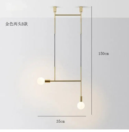 Modern black rose gold minimalist pendant light with gold spherical bulbs and geometric frame for dining room decorbites black rose