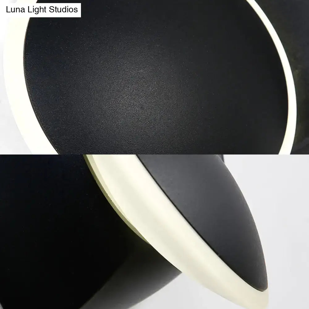 Modern black rotatable led wall sconce with matte finish and integrated white led ring for bedroom lighting