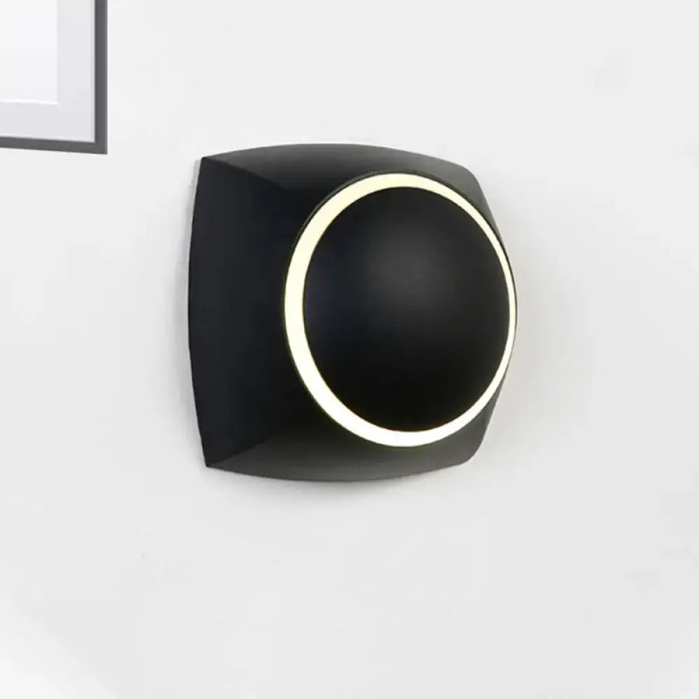 Modern black rotatable led wall sconce with matte finish and circular illuminated ring for bedroom lighting