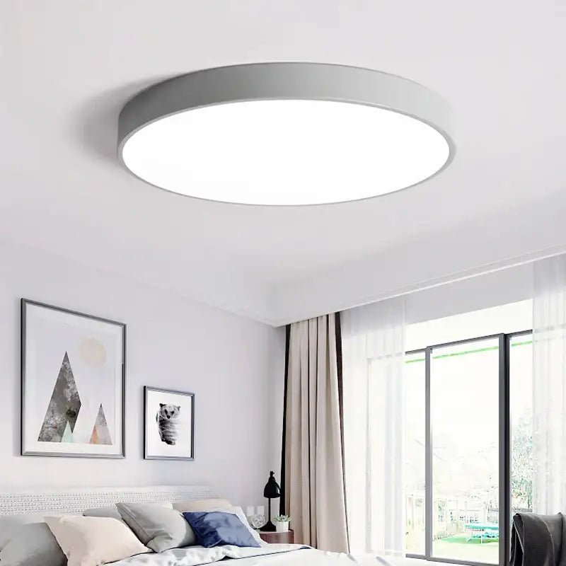 Modern black round dimmable led ceiling light with sleek gray metallic frame and bright white diffused panel by decorbites