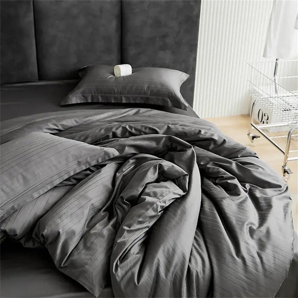 Dark gray striped duvet cover set with smooth satin jacquard finish and modern black bedroom bed skirt