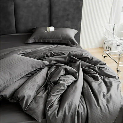Dark gray striped duvet cover set with smooth satin jacquard finish and modern black bedroom bed skirt