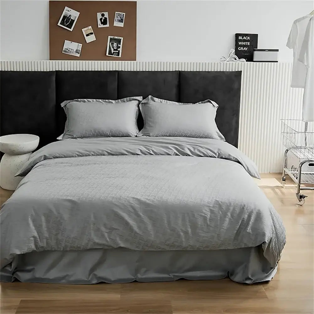 Modern black satin jacquard duvet cover set with gray textured duvet cover pillows and fitted sheet for bedroom use